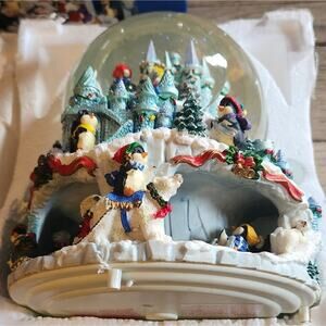 Vintage Kirkland Signature Peguians snow globe with box